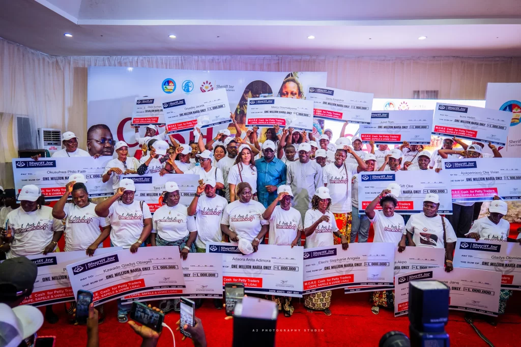 A group photograph with presentation cheques.